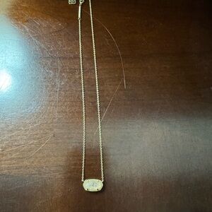 Kendra Scott necklace. Gold chain with vanilla colored stone.